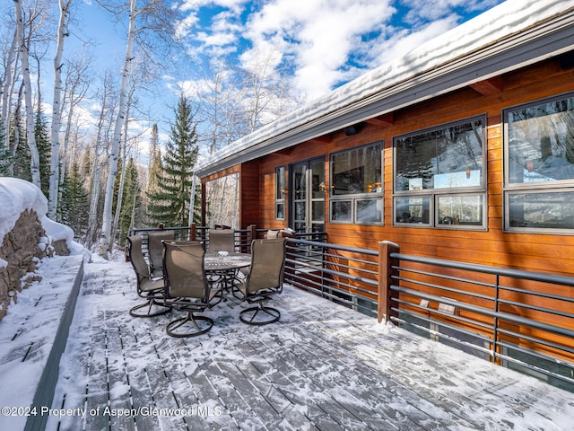 view of snow covered deck