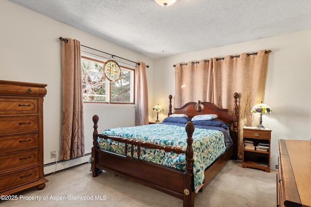 534 Spruce St, Aspen, CO 81611 - bedroom with a textured ceiling, light carpet, and a baseboard radiator