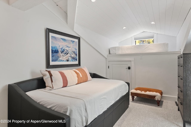 carpeted bedroom with wood ceiling and lofted ceiling