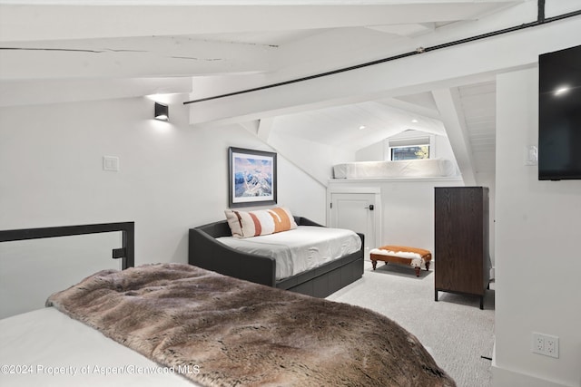 carpeted bedroom featuring vaulted ceiling with beams