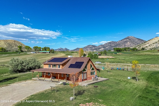 mountain view featuring a rural view