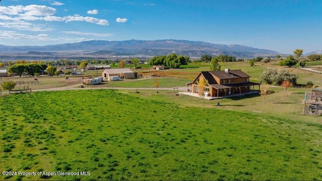 bird's eye view featuring a mountain view and a rural view