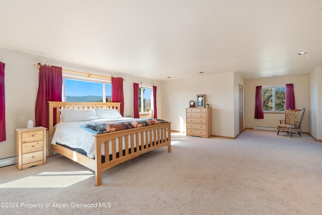 bedroom featuring light carpet