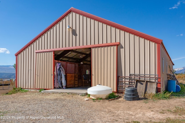 view of outbuilding featuring a mountain view