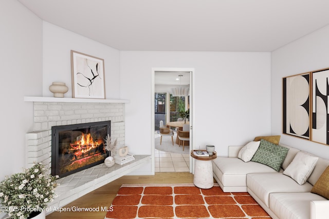 531 Gillespie St, Aspen, CO 81611 - living area with a brick fireplace and wood finished floors