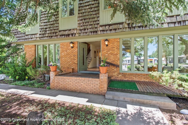 531 Gillespie St, Aspen, CO 81611 - view of exterior entry with brick siding and mansard roof