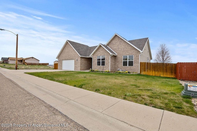 view of front of home with a garage, brick siding, and concrete driveway
