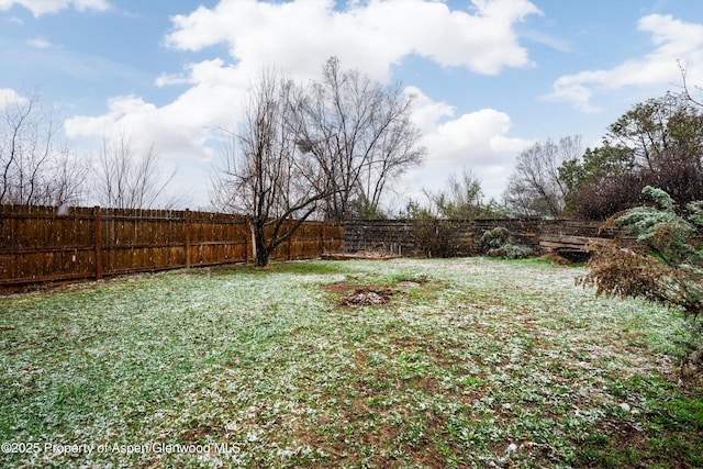 view of yard with a fenced backyard