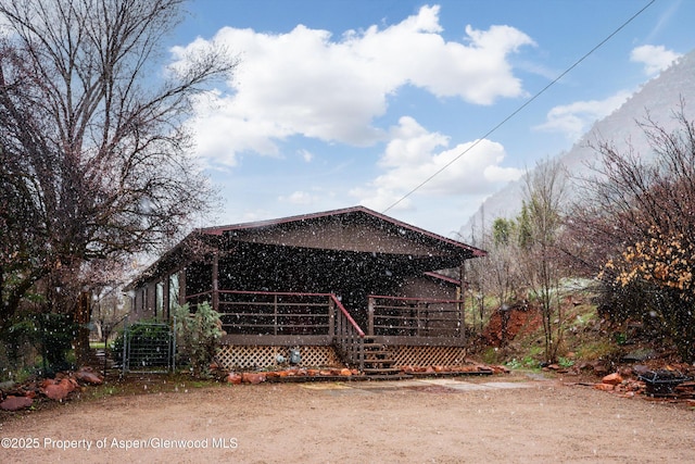 view of front of house featuring a deck