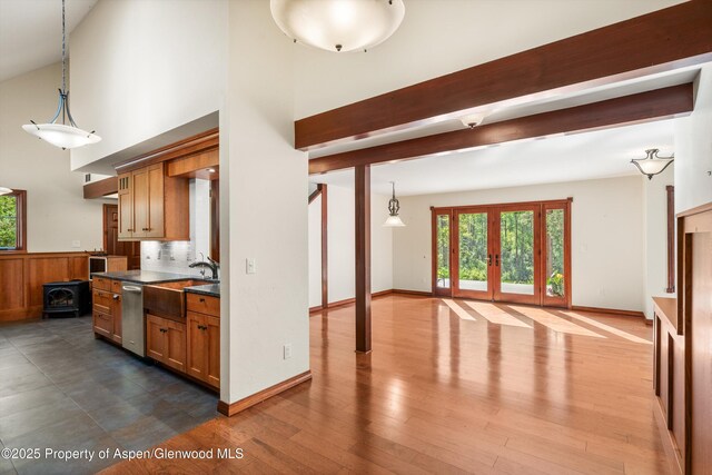 135 Irwin Dr, Redstone, CO 81623 - kitchen with dark countertops, french doors, open floor plan, dark wood-style floors, and brown cabinetry