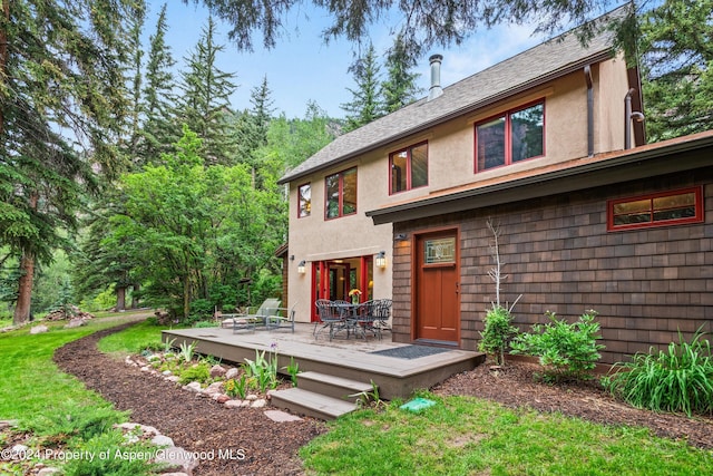 135 Irwin Dr, Redstone, CO 81623 - back of property featuring stucco siding, a wooden deck, and roof with shingles