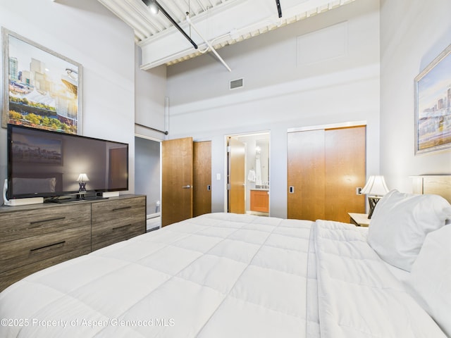 231 Robinson St Unit R306, Basalt, CO 81621 - bedroom featuring a towering ceiling and ensuite bathroom