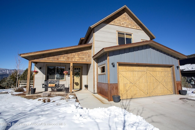 view of front facade featuring a porch and a garage