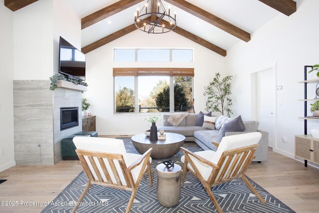 dining room with light wood-type flooring, a barn door, and plenty of natural light