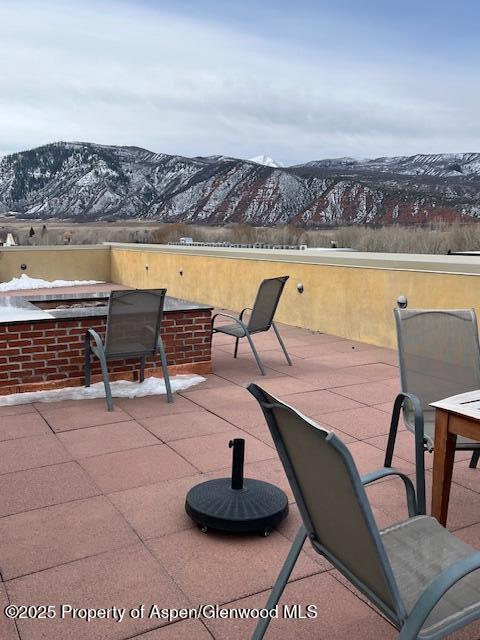 view of patio with a mountain view