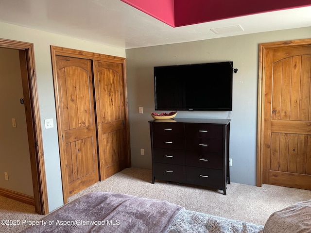 bedroom featuring light carpet