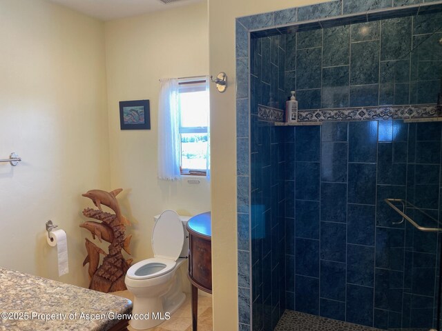 566 Latham Ranch Rd, Rifle, CO 81650 - full bath with toilet, tiled shower, vanity, and tile patterned flooring