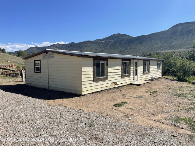 exterior space featuring a mountain view