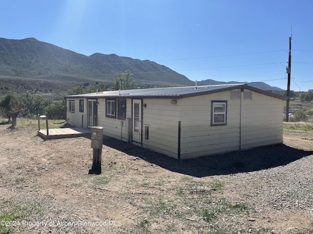 view of side of property with a mountain view