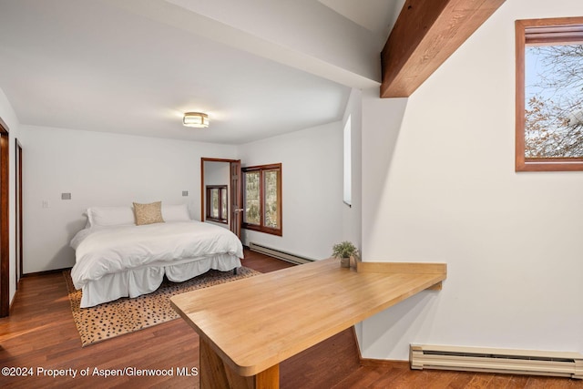 bedroom featuring dark hardwood / wood-style floors and baseboard heating