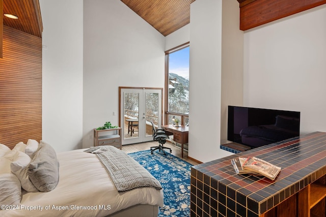 bedroom featuring lofted ceiling and wooden ceiling