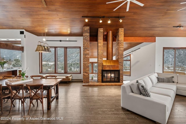 living room featuring a fireplace, dark hardwood / wood-style floors, ceiling fan, and wood ceiling