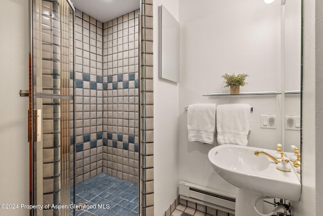 bathroom with a shower with shower door and a baseboard radiator