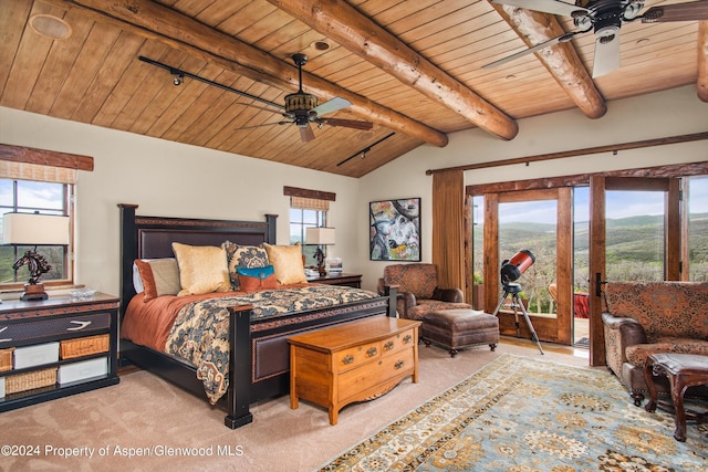 carpeted bedroom with ceiling fan, beam ceiling, and wood ceiling