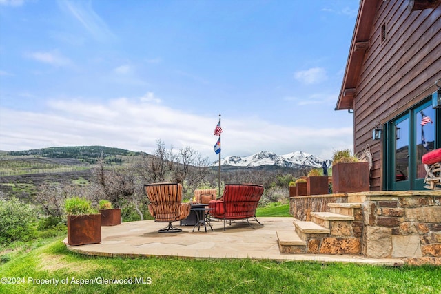 view of patio / terrace featuring a mountain view