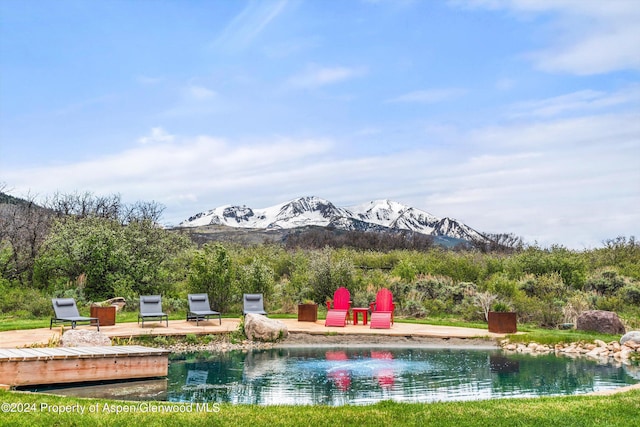 view of pool with a mountain view