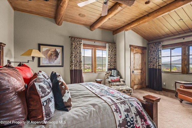 carpeted bedroom with ceiling fan, beamed ceiling, and wooden ceiling