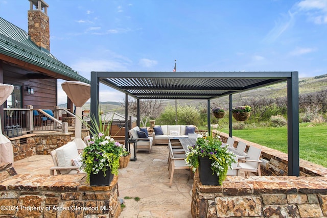 view of patio featuring a pergola and outdoor lounge area