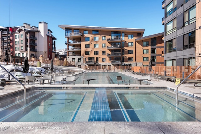 view of swimming pool featuring a patio area