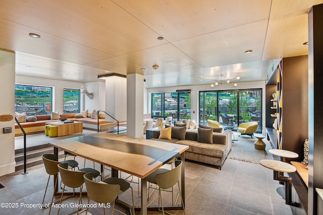 dining area featuring light tile patterned floors and a healthy amount of sunlight