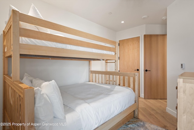 bedroom with light hardwood / wood-style floors