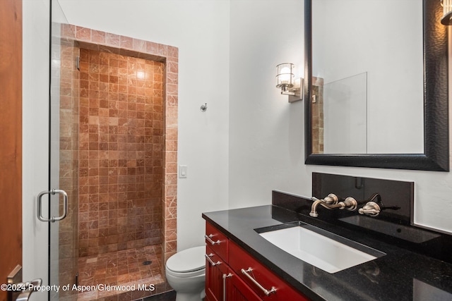 199 Bluestem Ct, Carbondale, CO 81623 - bathroom with a shower with door, vanity, and toilet