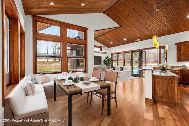 199 Bluestem Ct, Carbondale, CO 81623 - dining room with hardwood / wood-style floors, high vaulted ceiling, wooden ceiling, and an inviting chandelier
