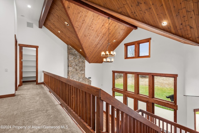 199 Bluestem Ct, Carbondale, CO 81623 - hallway featuring high vaulted ceiling, wooden ceiling, beamed ceiling, a chandelier, and carpet floors