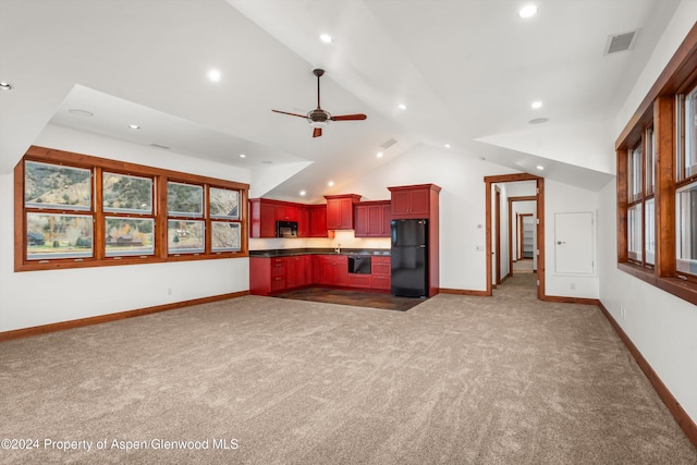 199 Bluestem Ct, Carbondale, CO 81623 - kitchen with ceiling fan, sink, dark carpet, vaulted ceiling, and black appliances