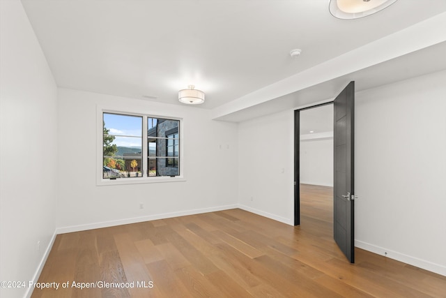 spare room featuring hardwood / wood-style floors