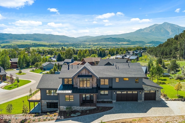 exterior space with a mountain view and a garage