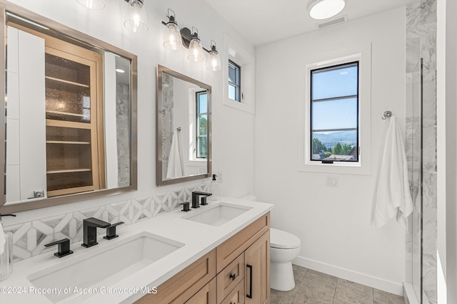 bathroom with tasteful backsplash, an enclosed shower, vanity, tile patterned flooring, and toilet