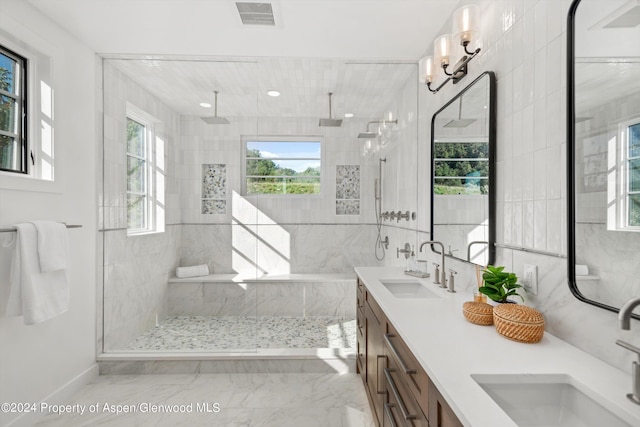 bathroom featuring vanity and a tile shower