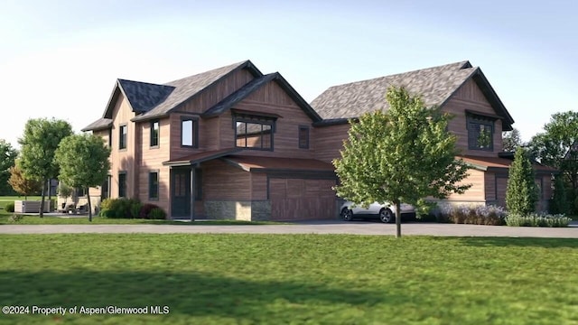 view of front facade with a front yard and a garage