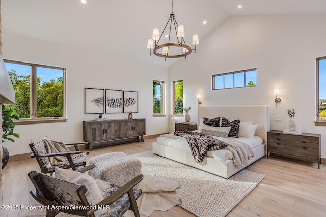 112 Bowles Dr, Carbondale, CO 81623 - bedroom featuring recessed lighting, a chandelier, high vaulted ceiling, light wood-style flooring, and baseboards