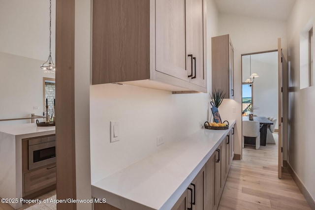 112 Bowles Dr, Carbondale, CO 81623 - hall featuring light wood-style flooring, lofted ceiling, and baseboards