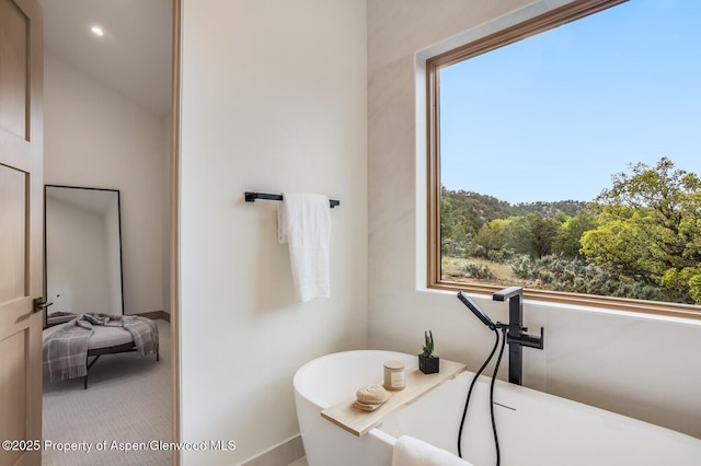 112 Bowles Dr, Carbondale, CO 81623 - bathroom with a freestanding tub, plenty of natural light, and baseboards