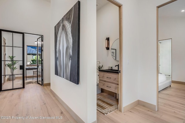 112 Bowles Dr, Carbondale, CO 81623 - corridor with wood finished floors, a towering ceiling, and baseboards