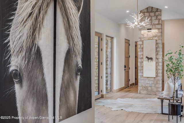 112 Bowles Dr, Carbondale, CO 81623 - foyer entrance featuring a chandelier, vaulted ceiling, wood finished floors, baseboards, and recessed lighting