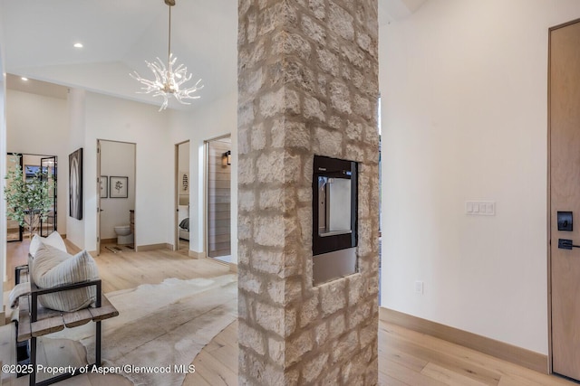 112 Bowles Dr, Carbondale, CO 81623 - hall featuring light wood finished floors, a chandelier, baseboards, and recessed lighting